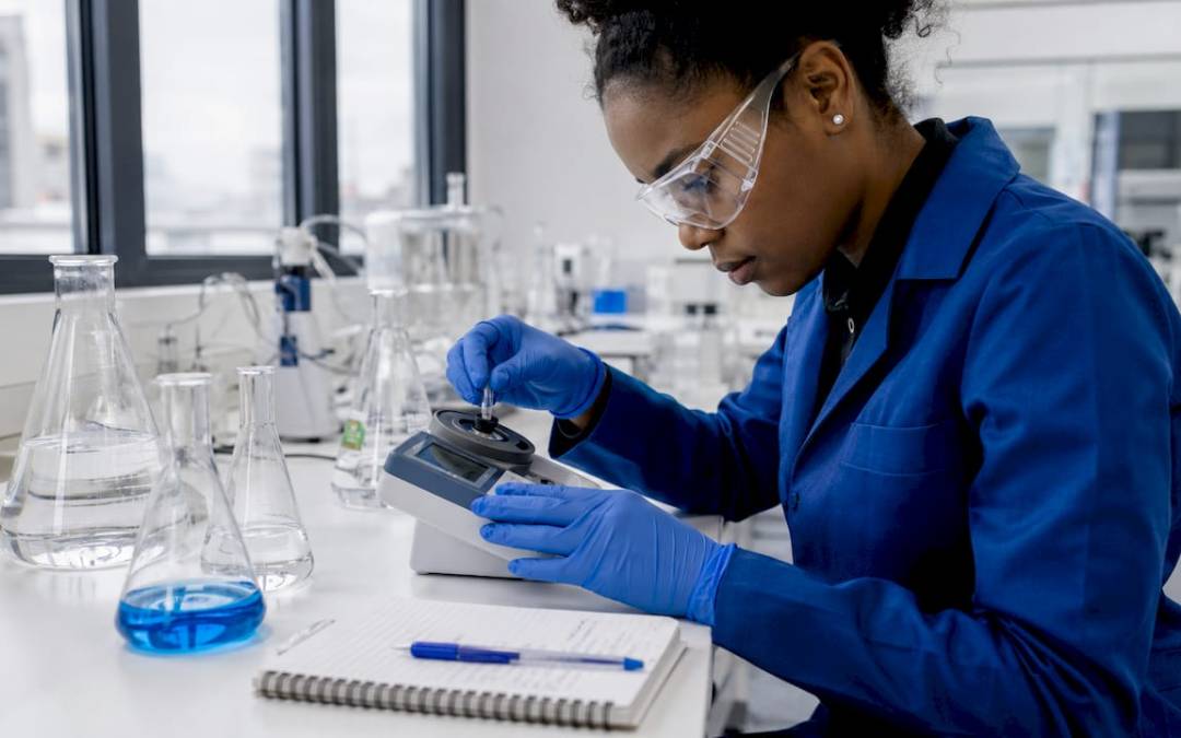 Technician measuring urea concentration in lab